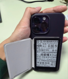 XTEINK X3 attached to the back of an iPhone Pro Max